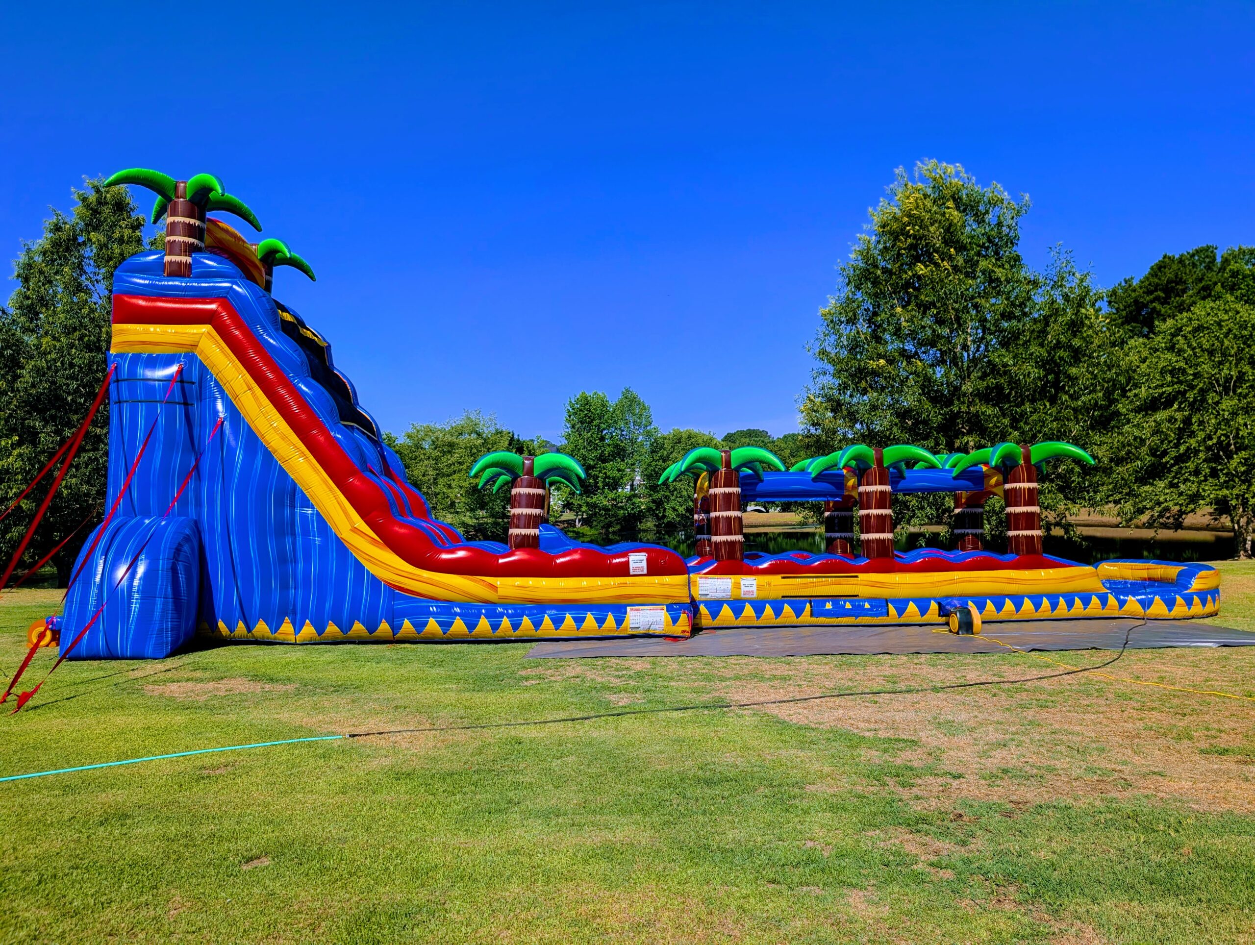 24ft Tsunami dual lane water slide with 35ft slip and slide rental from Inflatables NC
